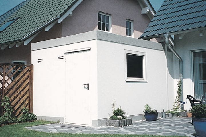 Einzelgarage mit Anbau aus Stahlbeton als Fertiggarage von JUWEL