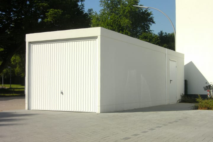 Einzelgarage mit Anbau aus Stahlbeton als Fertiggarage von JUWEL